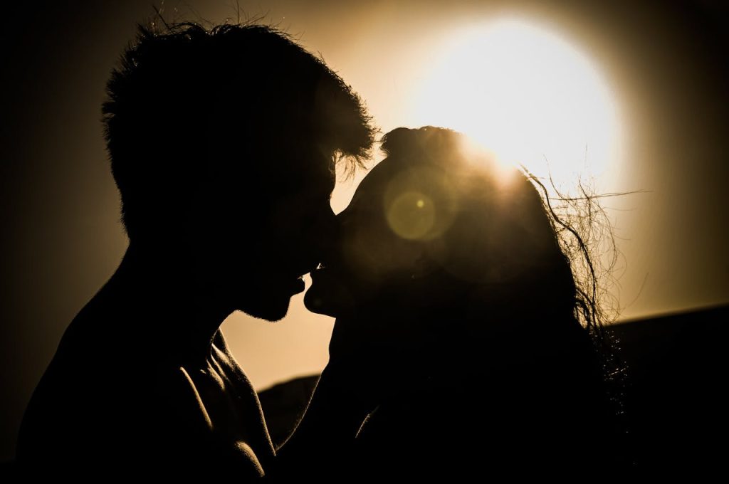 pexels-photo-41068 Silhouette of a couple kissing with the sun setting in the background, creating a romantic atmosphere.